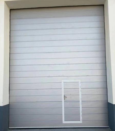 哈尔滨工业提升门带小门定做安装